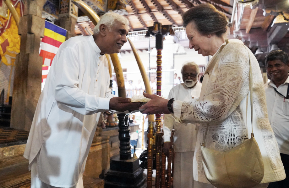 The Princess Royal prepares to offer jasmine flowers during a visit the Temple of the Sacred Tooth Relic in Kandy during day two of their visit to mark 75 years of diplomatic relations between the UK and Sri Lanka.