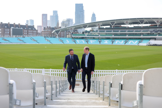 The Prince of Wales walks up the steps at The Kia Oval cricket ground in London