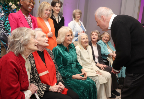 Gyles Brandreth speak to Queen Camilla as whilst posing for a photo with Floella Benjamin, Twiggy Lawson, Harriet Walter, Maureen Lipman (left to right front row) Virginia McKenna, Sian Phillips, Vanessa Redgrave, Penelope Keith and Patricia Routledge at a Celebration of Shakespeare event at Grosvenor House, central London, marking 400 years since the first…