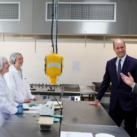 The Prince of Wales speaks with business owners in a lab at Cardiff Metropolitan University