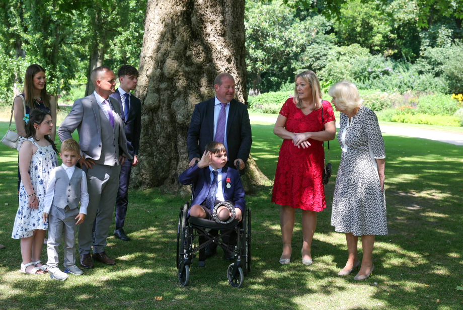 The Donovan family, The Hudgell family and The Queen (R). Tony Hudgell is saluting